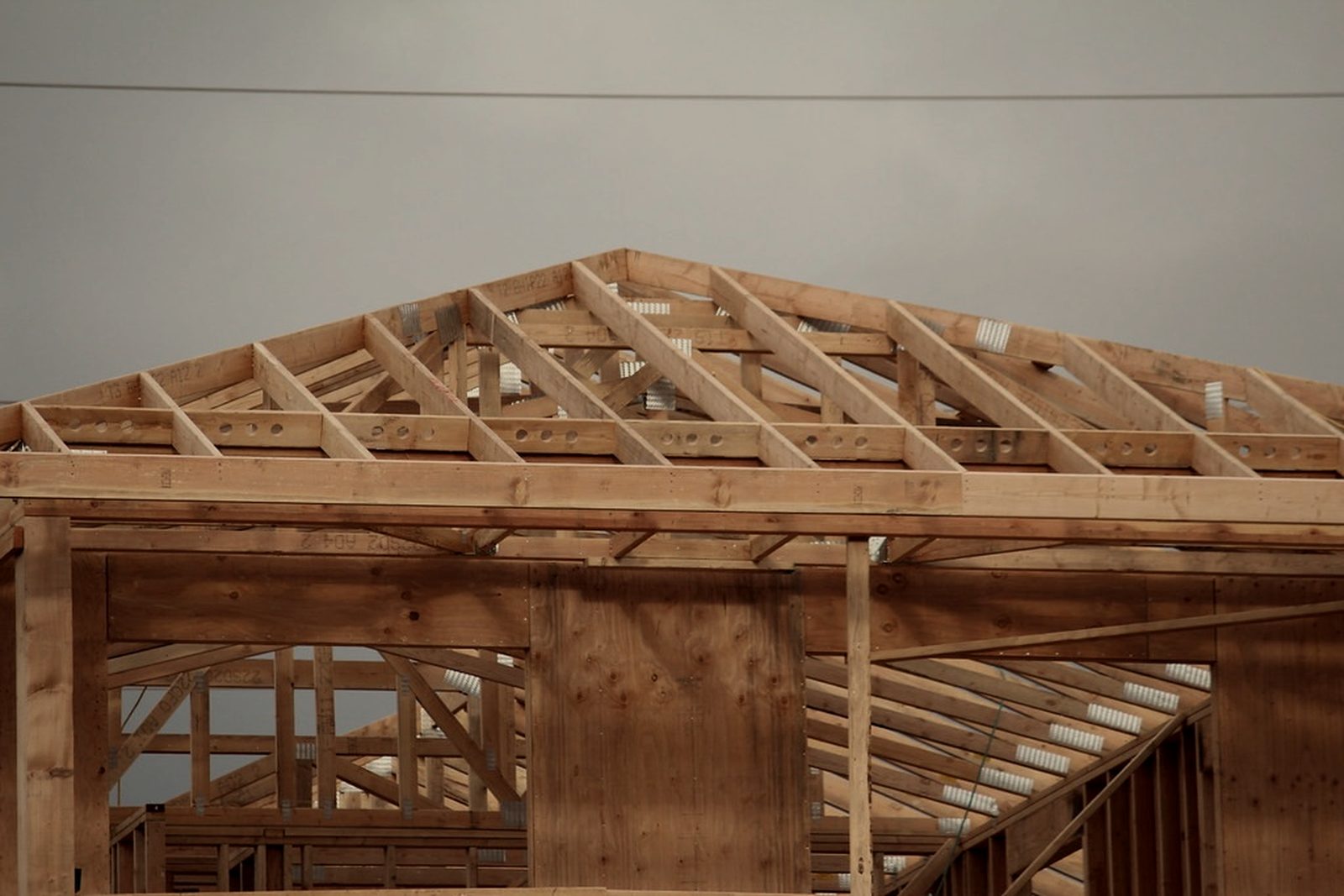 Timber roof trusses and wall framing on a new home under construction